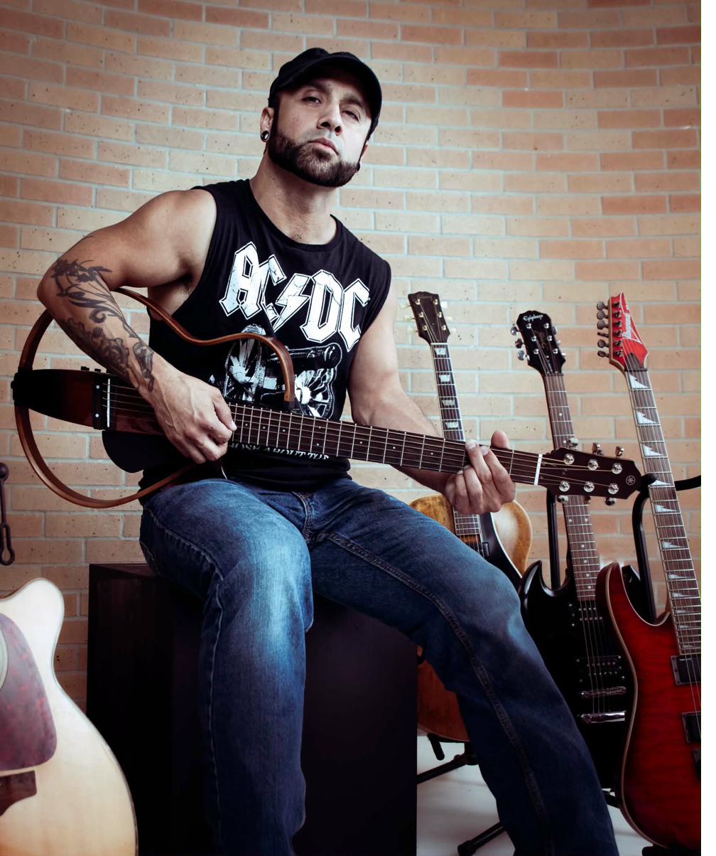 Robert Jericho playing guitar